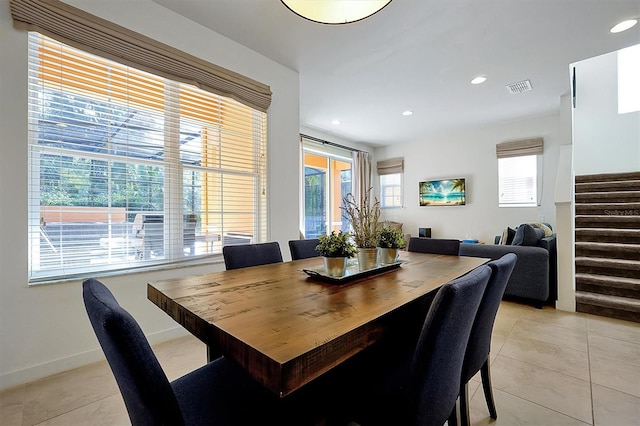 dining area featuring light tile patterned flooring