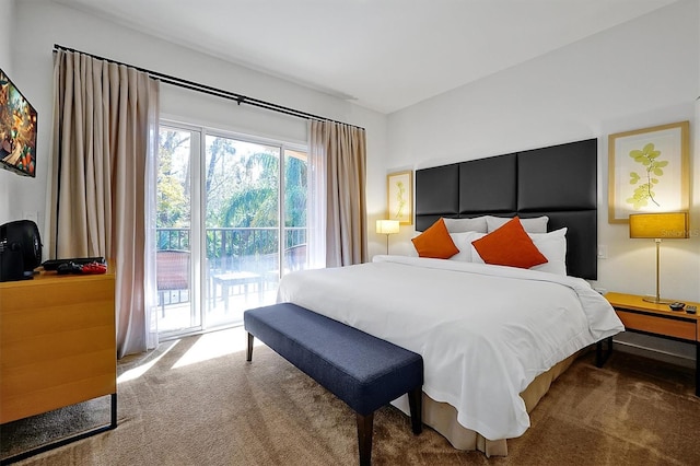 bedroom featuring carpet and access to outside