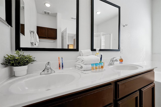 bathroom featuring vanity and an enclosed shower