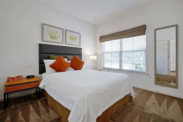 bedroom featuring dark colored carpet