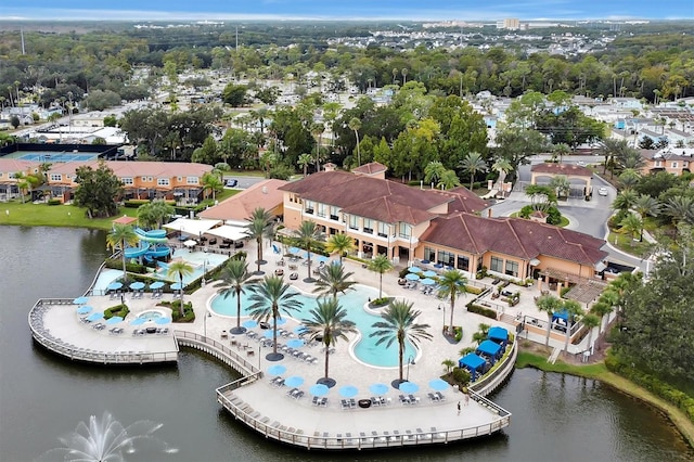 birds eye view of property with a water view