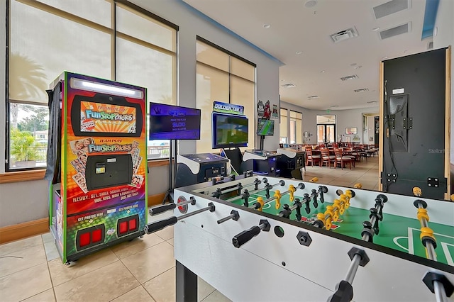 rec room with light tile patterned flooring