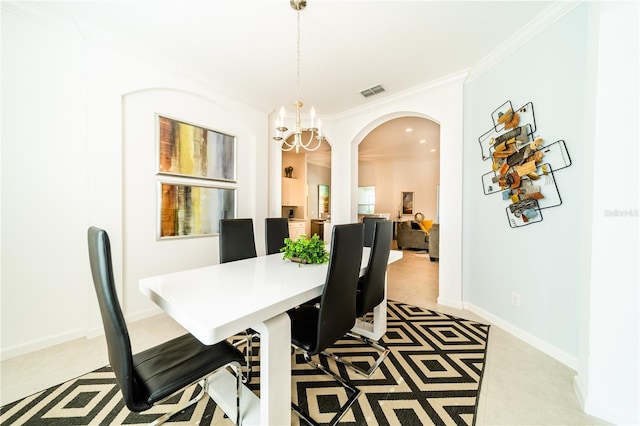 dining room featuring crown molding and a notable chandelier