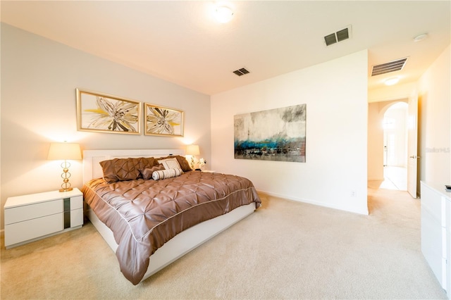 bedroom featuring light colored carpet