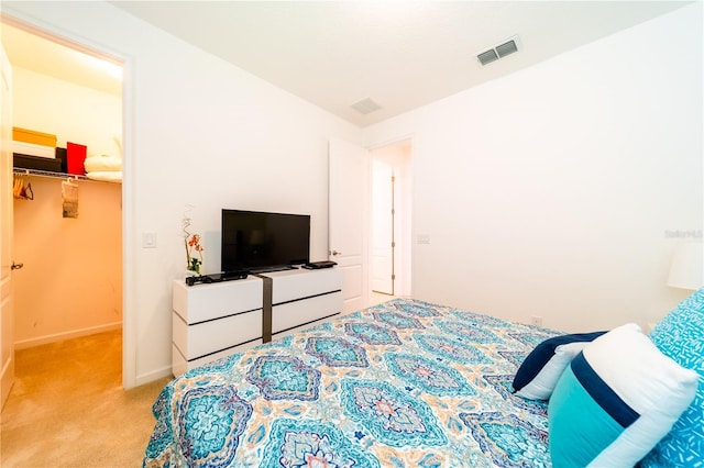 carpeted bedroom featuring a closet