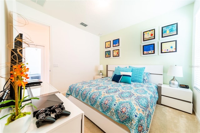 bedroom featuring light colored carpet