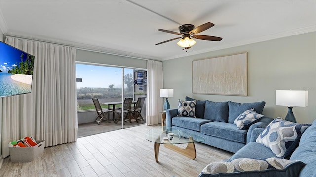 living room with light hardwood / wood-style flooring, ceiling fan, and ornamental molding