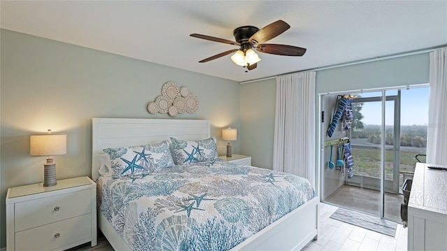 bedroom with ceiling fan, access to exterior, and light hardwood / wood-style flooring