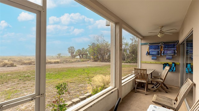 sunroom / solarium with ceiling fan