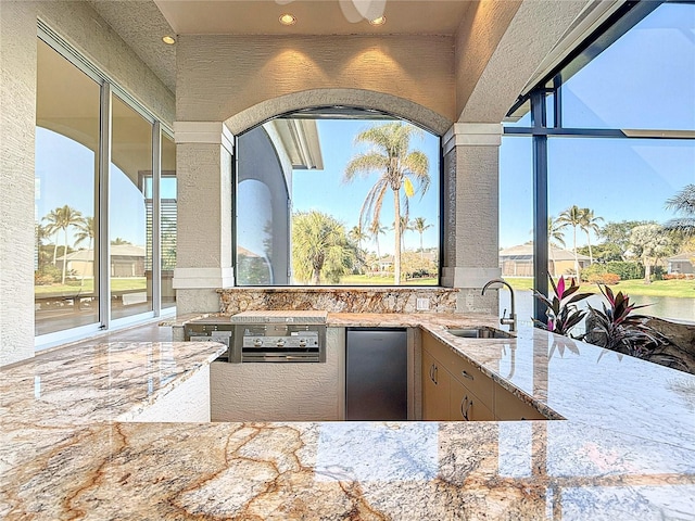 view of patio featuring sink and exterior kitchen