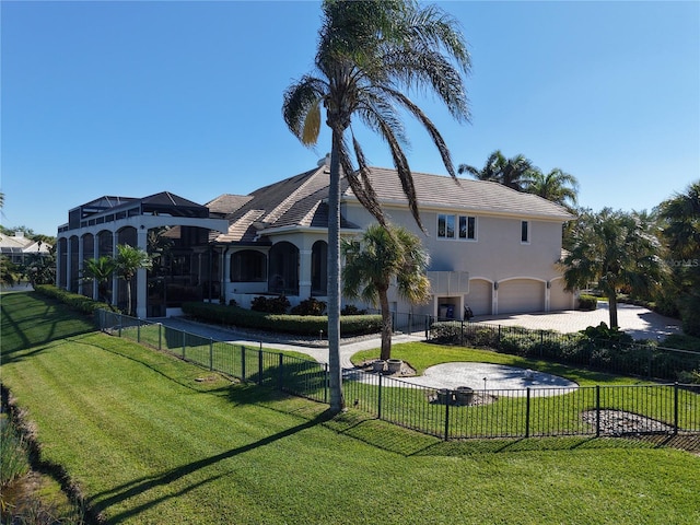 view of front of house with a front yard and a garage