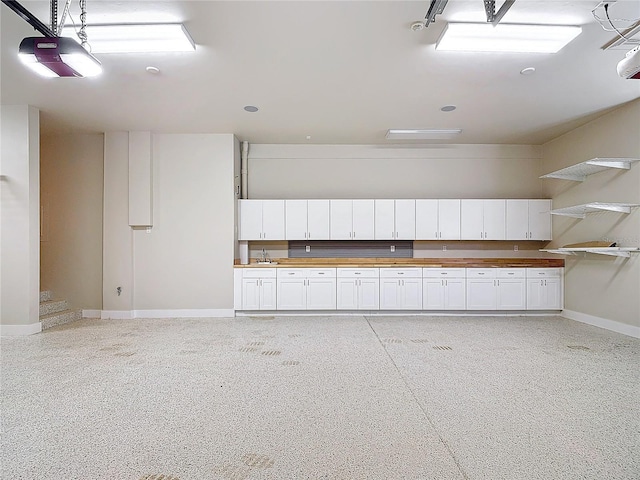 garage with sink and a garage door opener