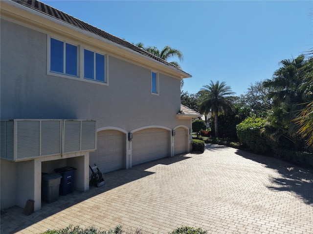 view of side of property with a garage