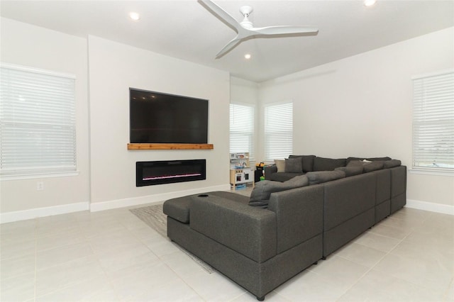 tiled living room with ceiling fan