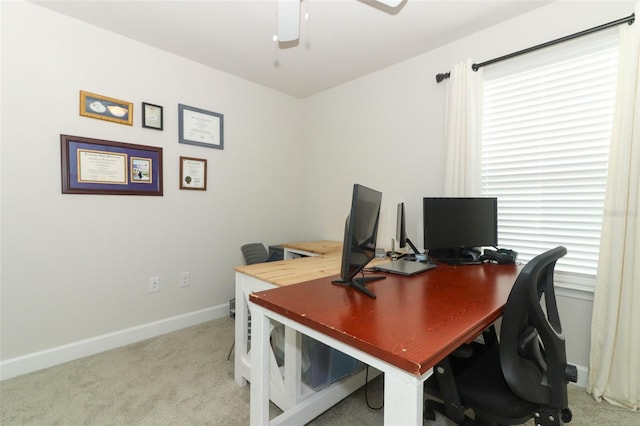 carpeted office with ceiling fan