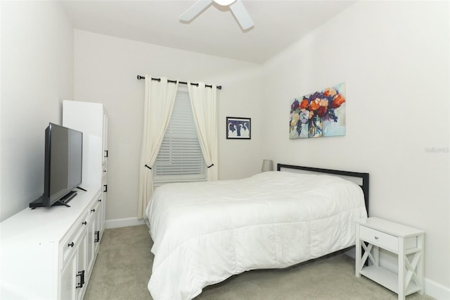 bedroom featuring ceiling fan and light carpet