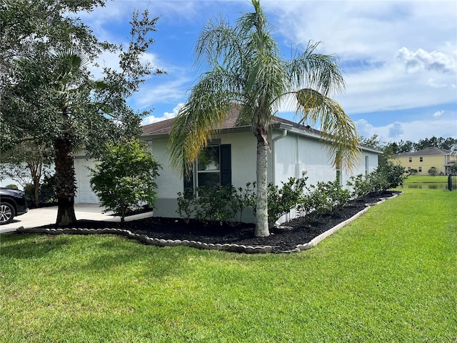 view of property exterior with a lawn