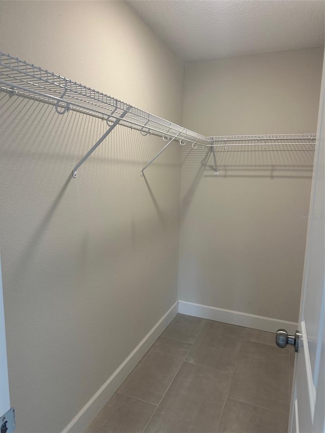 walk in closet featuring tile patterned floors