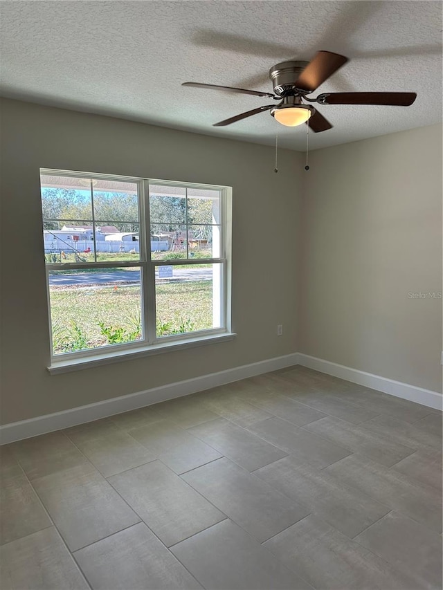 empty room featuring a textured ceiling