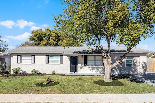 ranch-style house with a front lawn