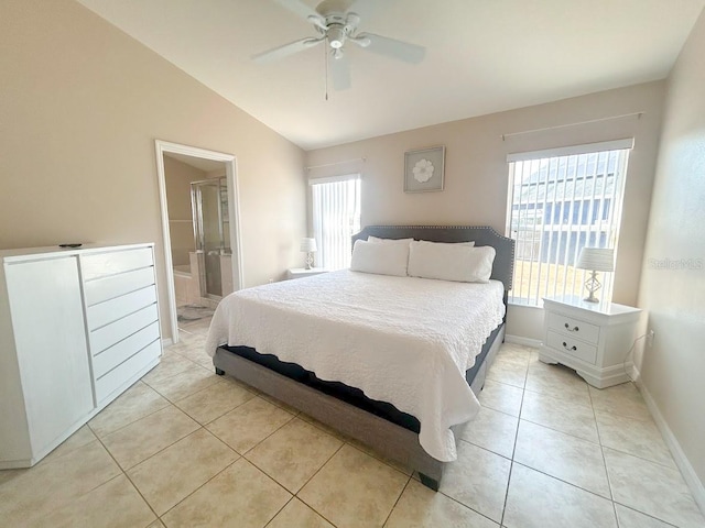 tiled bedroom with ensuite bathroom, ceiling fan, and lofted ceiling