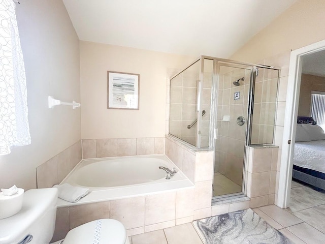 bathroom featuring plus walk in shower, tile patterned floors, lofted ceiling, and toilet