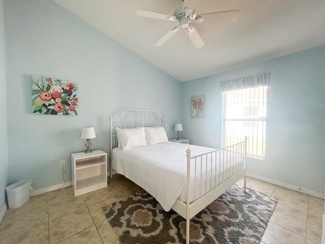 bedroom with tile patterned flooring, vaulted ceiling, and ceiling fan