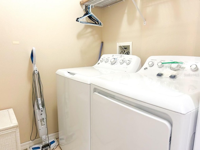 laundry room featuring washing machine and dryer