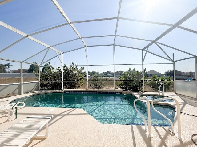 view of pool with a lanai and a patio area