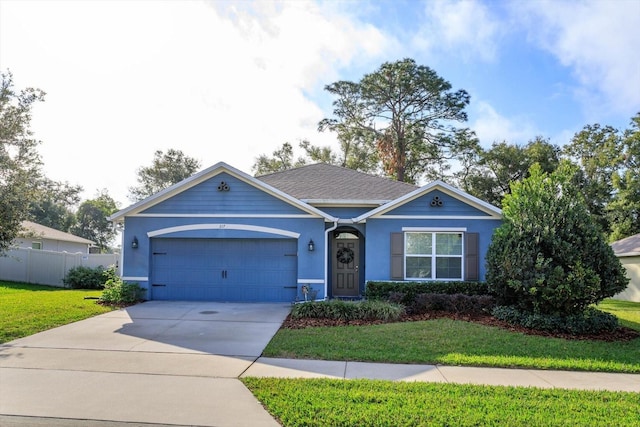 single story home with a front yard and a garage