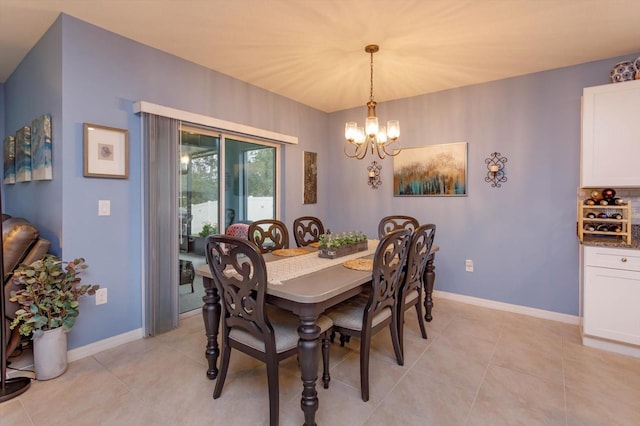 dining room featuring light tile patterned floors and an inviting chandelier