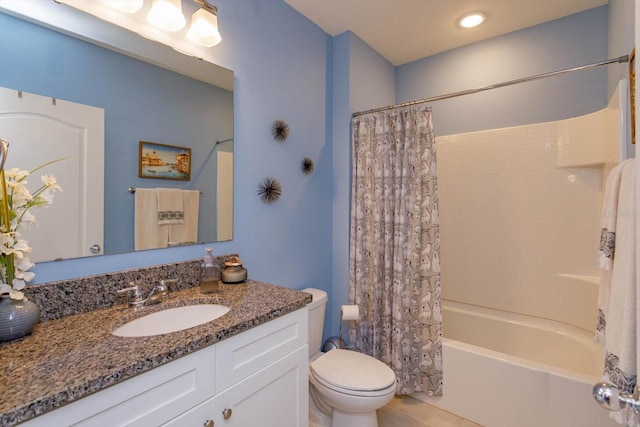 full bathroom with vanity, toilet, and shower / tub combo