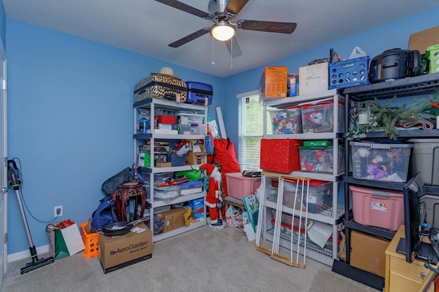 storage area featuring ceiling fan