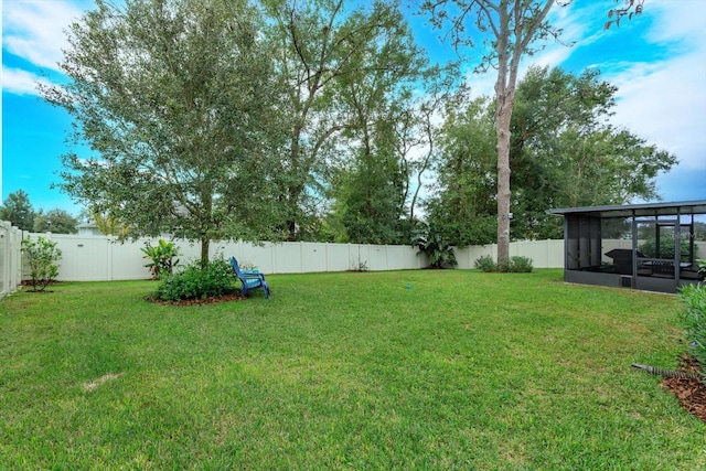 view of yard featuring a sunroom