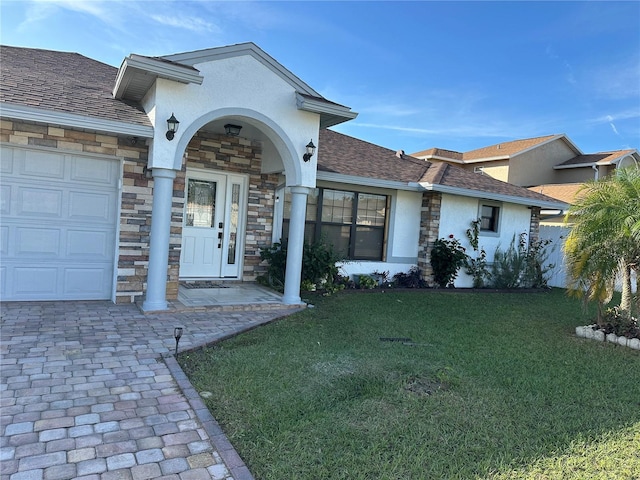 single story home with a front lawn and a garage