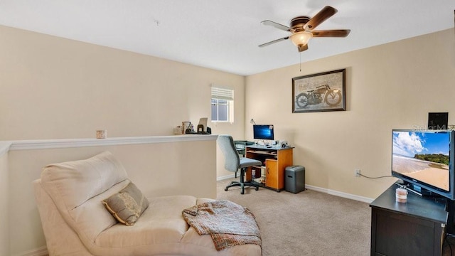 office featuring carpet floors, ceiling fan, and baseboards