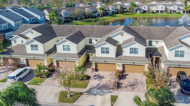 aerial view featuring a residential view and a water view