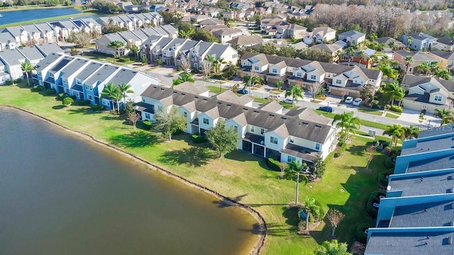 birds eye view of property with a residential view and a water view