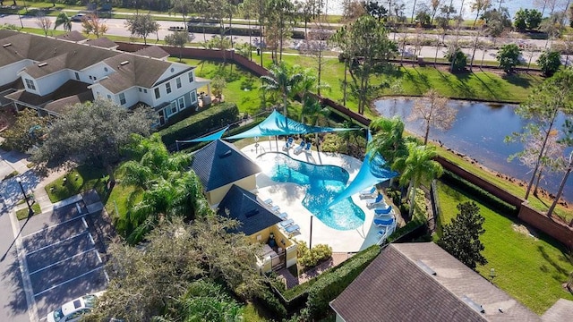 drone / aerial view featuring a residential view and a water view