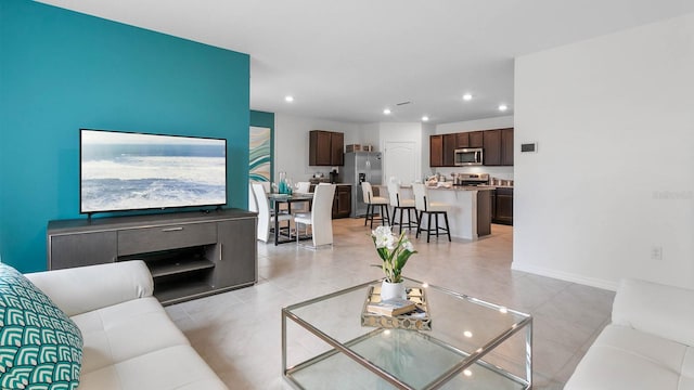 living room featuring light tile patterned floors