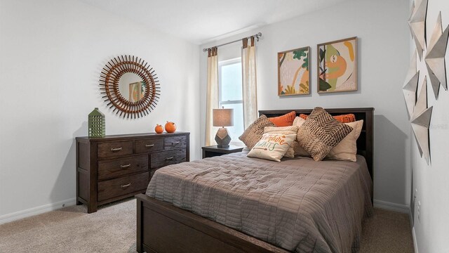 bedroom featuring light carpet