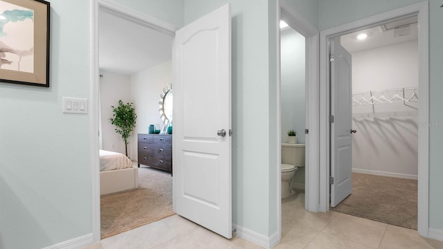 bathroom featuring tile patterned floors and toilet