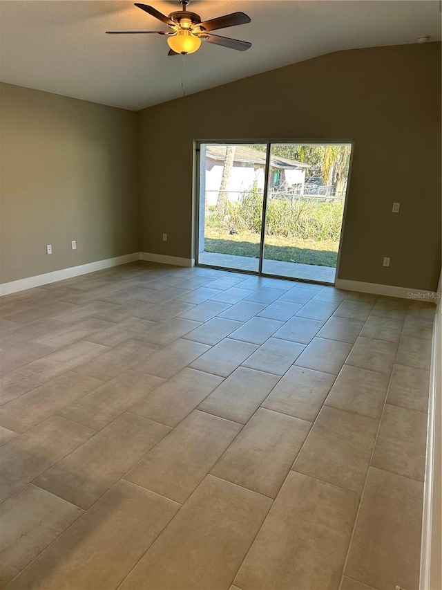 tiled empty room with lofted ceiling and ceiling fan