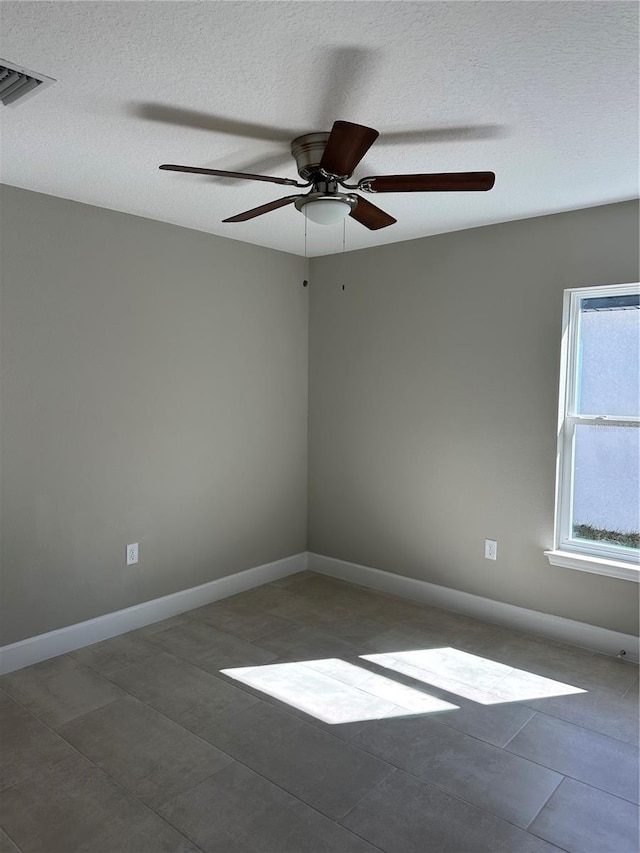 empty room with a textured ceiling