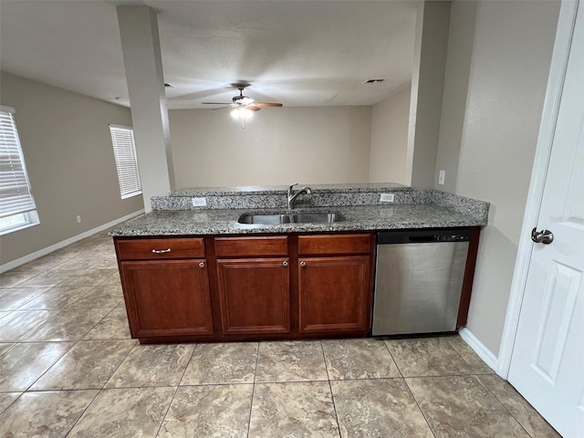 kitchen featuring light stone counters, stainless steel dishwasher, ceiling fan, sink, and light tile patterned flooring