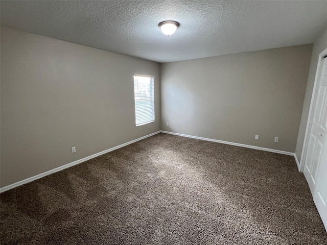 unfurnished bedroom with carpet flooring, a closet, and a textured ceiling