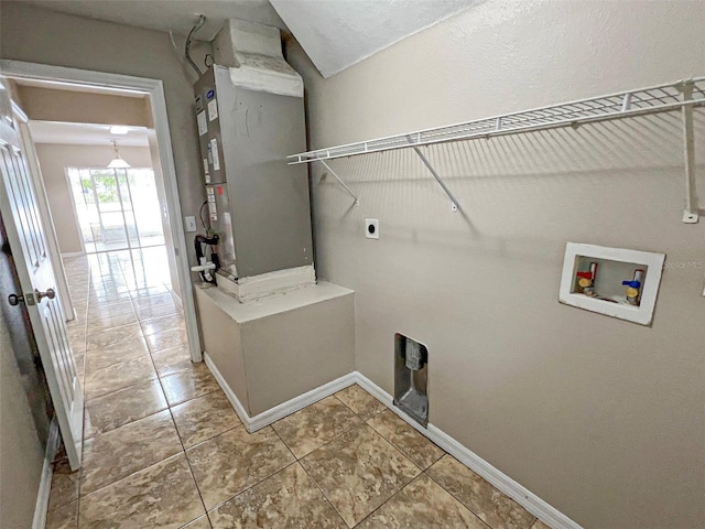 laundry room featuring tile patterned floors, heating unit, washer hookup, and hookup for an electric dryer