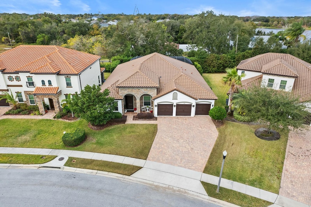 view of front of house with a front lawn and a garage