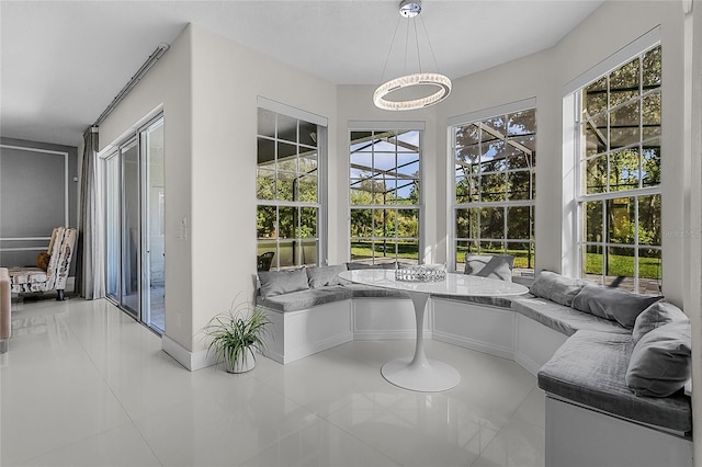 sunroom / solarium featuring breakfast area