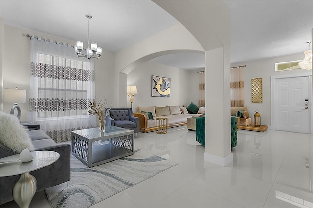 tiled living room with a chandelier and plenty of natural light